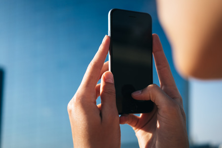 Blank mock up of smart phone and girl hands