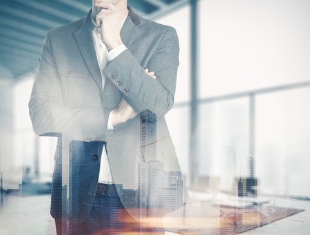 Double exposure business man at the office and thinking about plansの写真素材