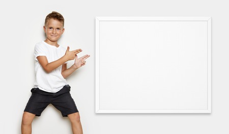 Mock up of young kid showing some action on the white backgroundの写真素材