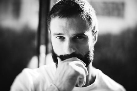 Black and white portrait of a handsome bearded man wearing white tshirtの写真素材