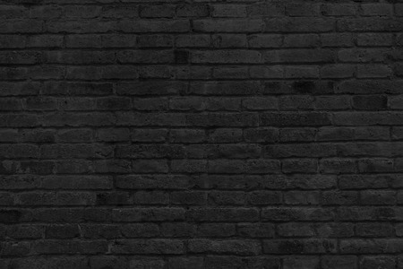 Part of black painted brick wall, horizontal.の写真素材