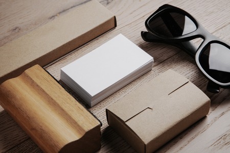 Set of  branding elements on the natural wood on a background. Black sunglasses