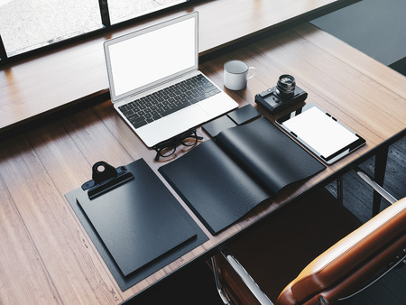 Generic laptop on the workspace with business elements.の写真素材