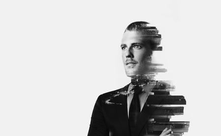 Double exposure of young  businessman  and night city in the backgroundの写真素材