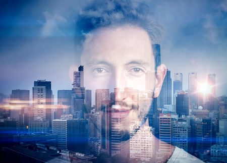 Portrait of  young man. Double exposure concept with man and city on the background.の写真素材