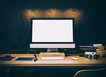 Photo of generic design computer screen on the table. Workspace. Horizontal