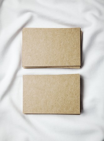 Closeup of craft business cards on white tshirt.の写真素材