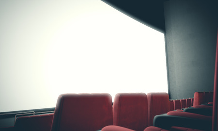 Closeup of empty cinema screen with red seats. Ready for adding your for advertisement. With color filter, wideの写真素材