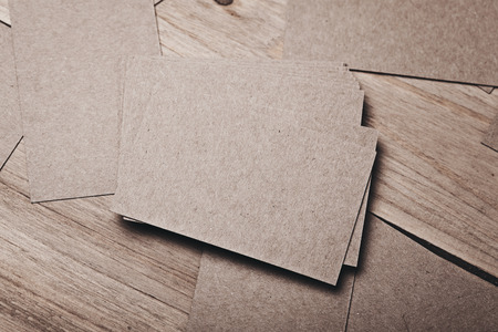 Closeup of blank and craft businesscards on natural wood table. Horizontalの写真素材