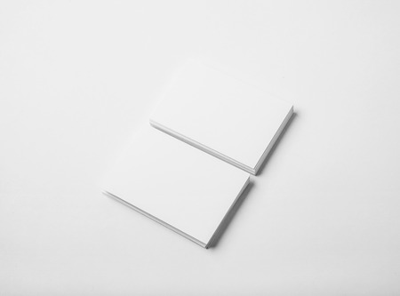 Two stack of blank and white business cards on white background with soft shadows.  Horizontalの写真素材