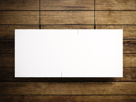 Photo of blank white canvas hanging on the wood background.の写真素材
