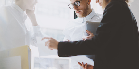 Team work process. Photo young coworkers crew working with new startup project. Project managers meeting. Analyze plans, papers.の写真素材