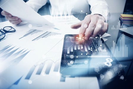 Risk Management Work process.Photo Trader working Market Report Documents Touching Screen Tablet.Using Graphic Icons,Stock Exchanges Reports. Business Project Startup. Horizontal, Flares Effect. Risk Management Work process.Photo Trader working Market Report Documents Touching Screen Tablet.Using Graphic Icons,Stock Exchanges Reports. Business Project Startup. Horizontal, Flares Effect.