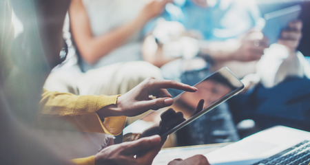 Closeup Young Woman Using Modern Tablet Hand.Hipster Making Great Business Idea.Coworker People Professional Gathered Together Decision Corporate Work.Startup Creative Presentation Concept Blurred.の写真素材