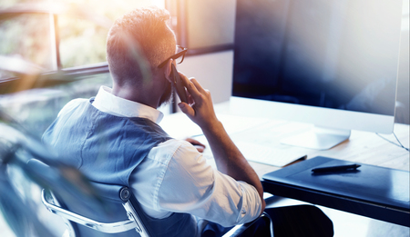 Closeup Bearded Businessman Wearing White Shirt Waistcoat Working Modern Loft Startup Computer.Creative Young Man Using Mobile Phone Call Business Meeting.Person Work Digital Tablet Desktop Tableの写真素材