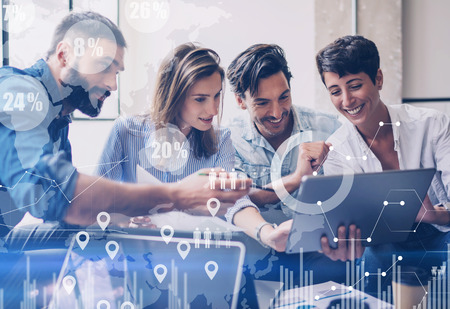 Concept of digital diagram,graph interfaces,virtual screen,connections icon on blurred background.Group of colleagues working with startup project in modern office..Horizontal.の写真素材