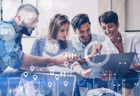 Concept of digital diagram,graph interfaces,virtual screen,connections icon on blurred background.Group of colleagues working with startup project in modern office..Horizontal.