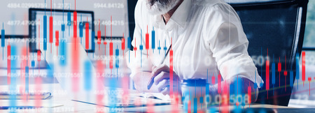 Double exposure.Professional stock traider making analysis of digital market and investment in block chain crypto currency. Stock trade concept. Wide.の写真素材
