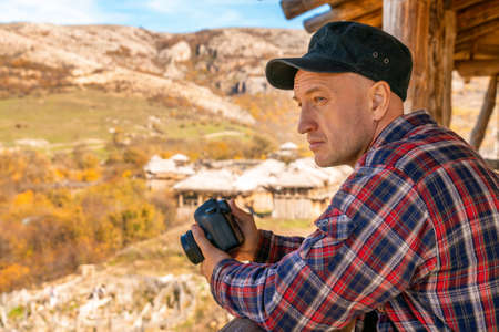 portrait of a man looking into the distance on the horizon tourism concept.