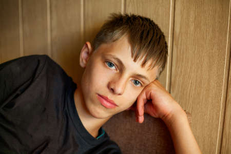 Close-up portrait of a young man looking at the camera.