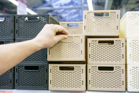Plastic baskets on the shelf in the store.