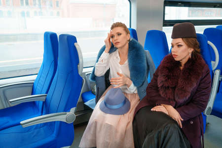 Two female friends on the train.