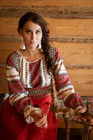 Beautiful young woman in national costume.