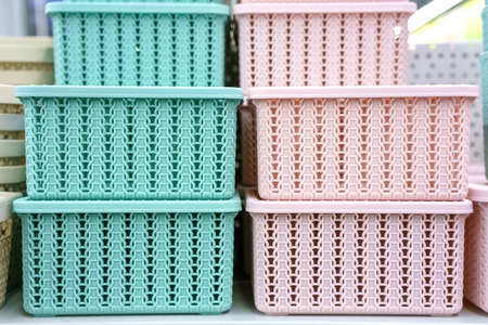 Plastic baskets on the shelf in the store.の写真素材