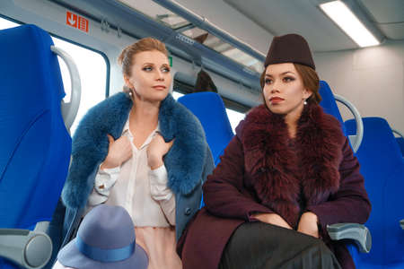 Two female friends on the train.の写真素材