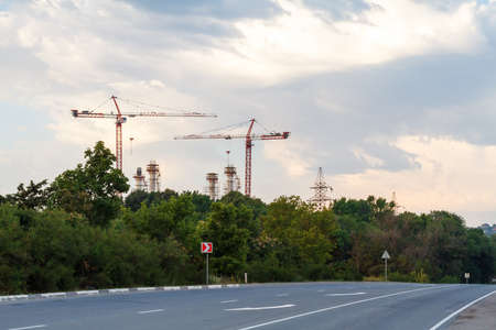 Construction cranes on the horizon.