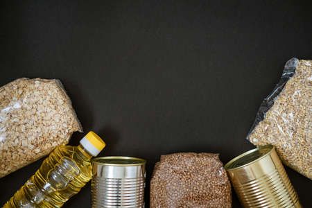 Grains on a black background, the concept of donation.の写真素材