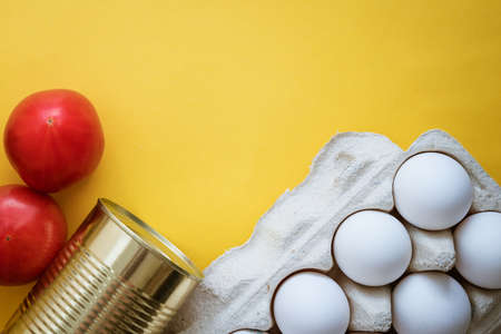 Food on a yellow background, vegetables eggs and oil .の写真素材
