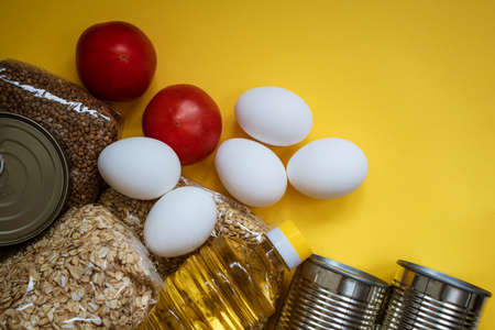 Food delivery on a yellow background, eggs and cere.