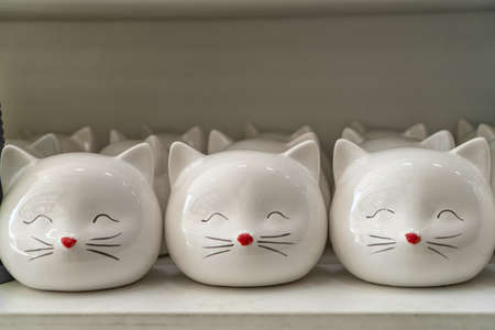 cats from porcelain Souvenirs on the counter.の写真素材