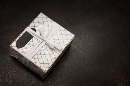 gift in box on dark background