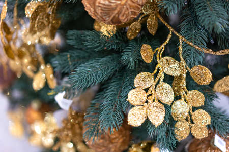 Christmas tree close-up with gold decorations