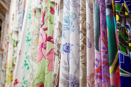 Multi-colored fabrics in the store close-up hangingの写真素材