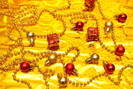 Christmas decor in gold and red color on a shiny background