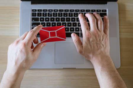male hands hold credit card with laptop, concept of online shopping in online store