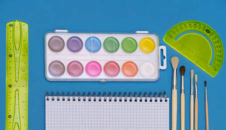 A pattern of brightly colored stationery accessories. Back to school. Education concept.