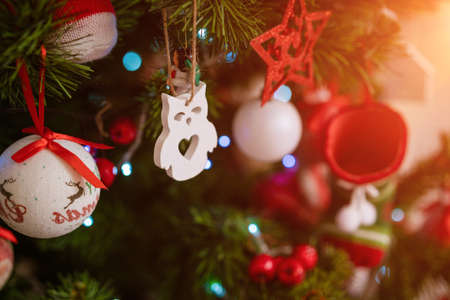 Beautiful christmas background, christmas toys and balls on the new year tree. Selective focus and soft lightの写真素材