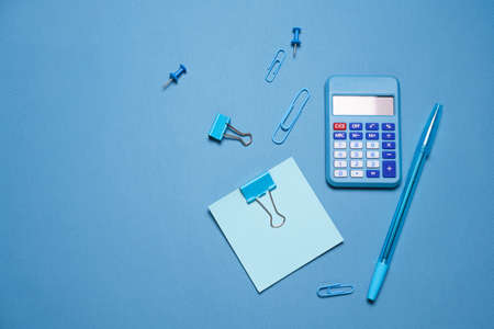 School objects, office supplies, tools and accessories isolated on blue background. Education conceptの写真素材