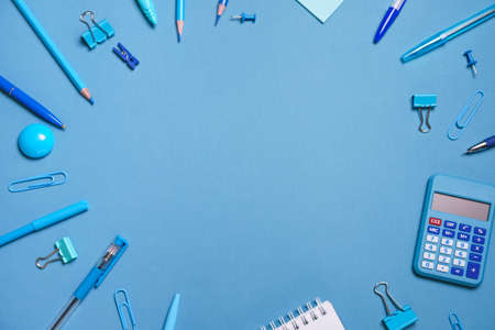 School objects, office supplies, tools and accessories isolated on blue background. Education conceptの写真素材