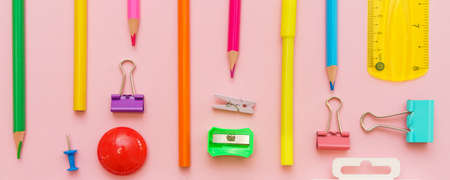 Supplies creative tools for school creative work on pink background stationery, colored pencils pens and felt-tip pens copy space, flat lay, back to school conceptの写真素材