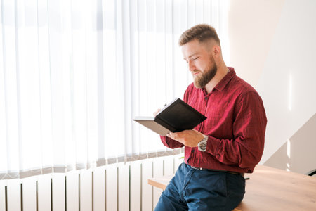 Planners scheduling calendar and agenda reminders, office work. Bearded man plan to meet daily and...