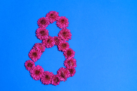 International Womens Day. Banner, flyer, beautiful postcard for March 8. Flowers in the shape of the...