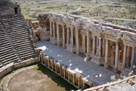 Ruins of theater in ancient Hierapolis now Pamukkale Turkey. Amphitheater (Coliseum) in ancient city Ephesus, Turkey in a beautiful summer dayの写真素材