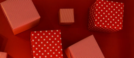 banner gift boxes of different sizes on a red background top viewの写真素材