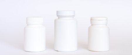 white bottles mockup on white background. Can be used for medical, cosmetic, food.の写真素材