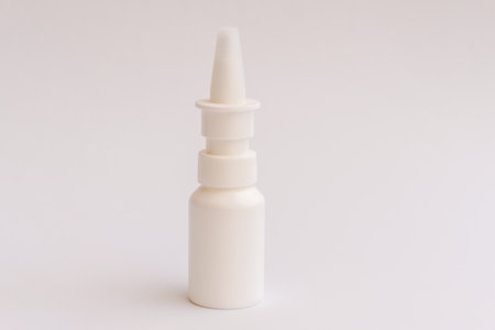 Template small plastic bottle with pipette, with cap, jar for drops for treatment nose, eyes ears, on background.の写真素材